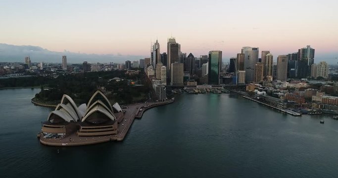Back in view of Sydney city CBD landmarks, business high-rise towers and circular quay ferry terminals over Harbour waters.
