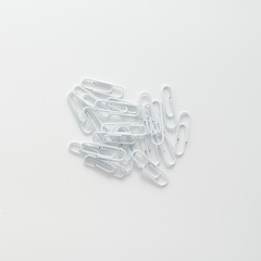 White paper clips isolated on white background