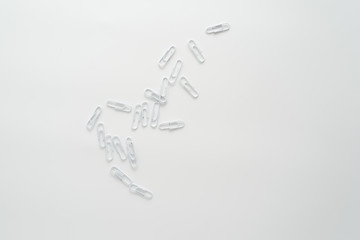 White paper clips isolated on white background