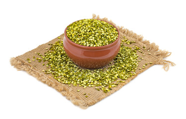 Raw Split Mung Bean Lentils or Mung Daal isolated on White Background