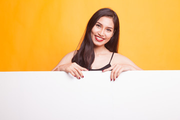 Fototapeta premium Young Asian woman with blank sign.