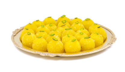 Indian Traditional Yellow Sweet Food Coconut Laddoo Also Know As Coconut Laddu, Ladoo, laddo Are Ball-Shaped Sweets. Isolated on White Background
