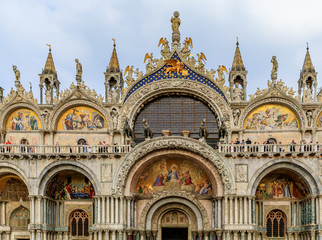 Fototapeta na wymiar Facade of Saint Mark's Basilica on Saint Mark's square in Venice Italy