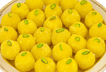 Indian Traditional Yellow Sweet Food Coconut Laddoo Also Know As Coconut Laddu, Ladoo, laddo Are Ball-Shaped Sweets. Isolated on White Background
