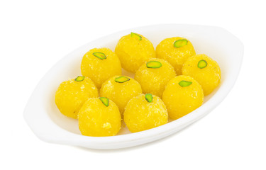 Indian Traditional Yellow Sweet Food Coconut Laddoo Also Know As Coconut Laddu, Ladoo, laddo Are Ball-Shaped Sweets. Isolated on White Background