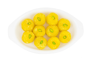 Indian Traditional Yellow Sweet Food Coconut Laddoo Also Know As Coconut Laddu, Ladoo, laddo Are Ball-Shaped Sweets. Isolated on White Background