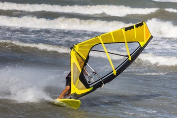 Sea Waves and Wind Surfing in the Summer in Windy Day