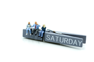 Miniature people : people feeling and sitting on list of saturday.