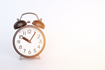 Still life, business deadline and time management concept : Black retro alarm clock on white background with copy space, ready for adding or mock up