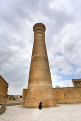 Photo of an ancient beautiful Oriental minaret in Uzbekistan