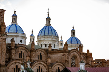 Fototapeta na wymiar Domes of New Cathedral tower over Cuenca, Ecuador
