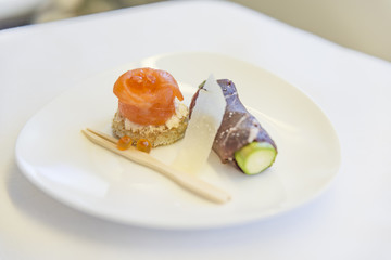 Set inflight meal roll on a tray, on a white table