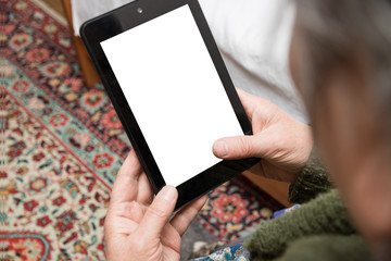 tablet in the hands of an elderly woman, mocap, older people use the Internet