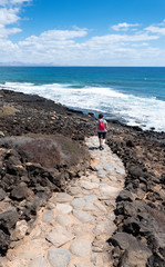 woman walking on the island of Lobos in Fuerteventura, Spain