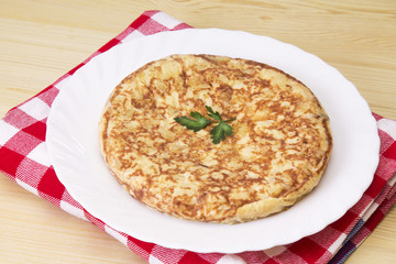 typical spanish omelette with potatoes and eggs