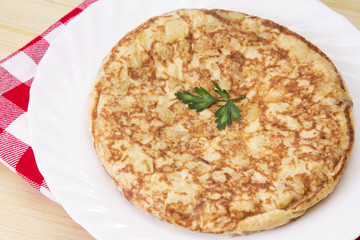 typical spanish omelette with potatoes and eggs