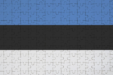 Estonia flag  is depicted on a folded puzzle