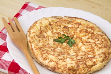 typical spanish omelette with potatoes and eggs