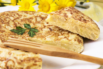 Piece of spanish omelette with potatoes and eggs