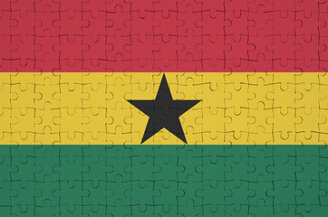 Ghana flag  is depicted on a folded puzzle