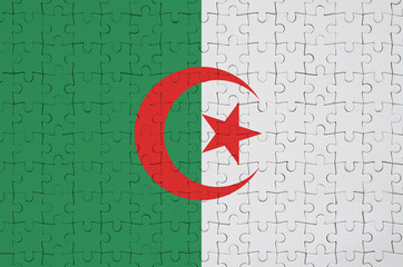 Algeria flag  is depicted on a folded puzzle