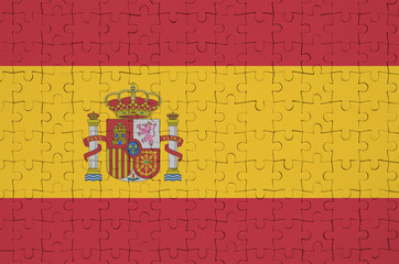 Spain flag  is depicted on a folded puzzle