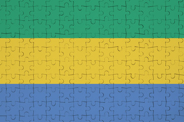 Gabon flag  is depicted on a folded puzzle