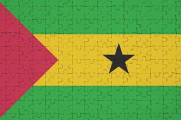 Sao Tome and Principe flag  is depicted on a folded puzzle