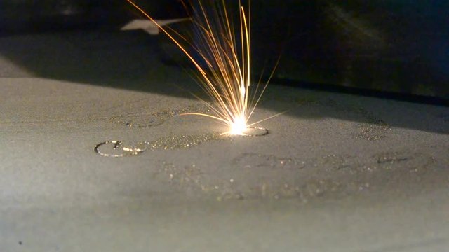 Laser sintering machine for metal. Metal is sintered under the action of laser into desired shape in working chamber. 3D printer printing metal. Modern additive technologies 4.0 industrial revolution