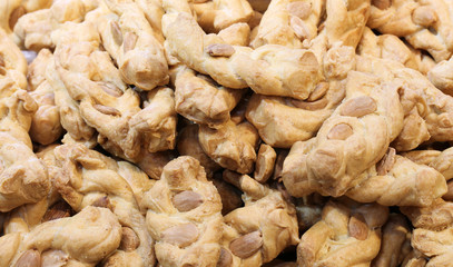 backgroud of cookies with almonds for sale in the bakery