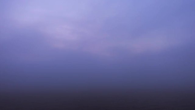 Beautiful sunrise over lake, fogy morning. Timelapse.