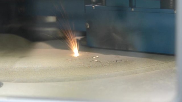 Working chamber Laser sintering machine for metal. Metal is sintered under the action of laser into desired shape in working chamber. 3D printer printing metal. Modern additive technologies