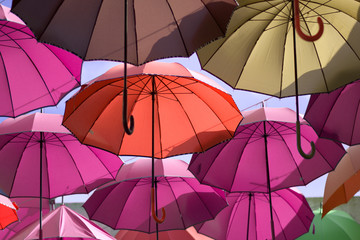 The flight of colored umbrellas
