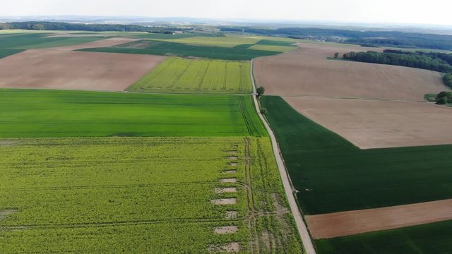 Beautiful grasslands and country landscape from above - aerial flight footage