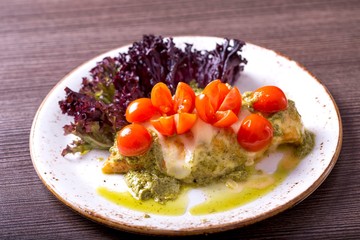 Chicken fillet with cherry tomatoes and pesto sauce