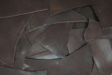 Cutting leather of different colors and decorations as a background for design