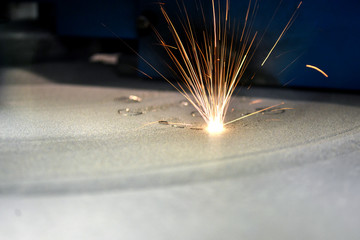3D printer printing metal. Laser sintering machine for metal. Metal is sintered under the action of...