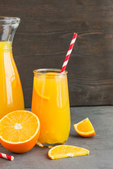 Decanter and glass of delicious citrus juice