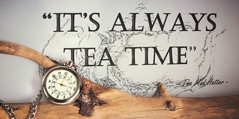 It´s always time for tea - silver pocket watch with chain on a tree branch quoting the Mad Hatter...