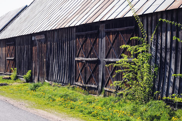Naklejka premium Old wooden barn in small village of Masovian Voivodeship in Poland
