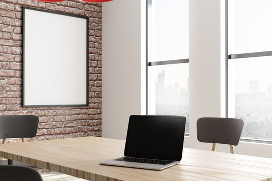 Modern conference room with poster and laptop
