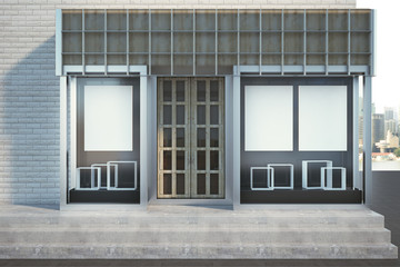Modern glass shopfront with poster