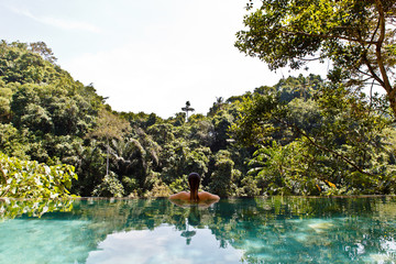 girl in the tropic jungle pool