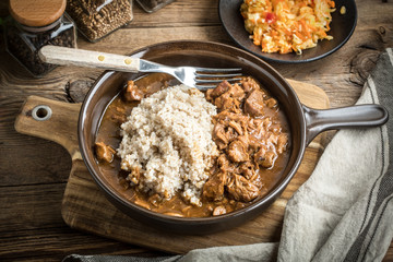 Barley groats with stewed meat.