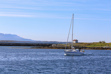 Sailboat arrives at the Bronnoysund port in Northern Norway