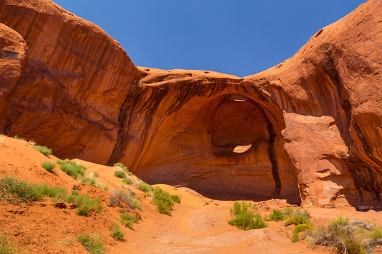 Eye of the eagle Big Hogan. Pothole natural arch eroded in sandstone.