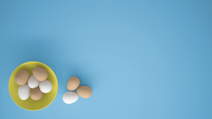 Chicken eggs into a yellow cup on the table, blue background with copy space, breakfast easter food concept idea, top view