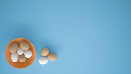 Chicken eggs into a orange cup on the table, blue background with copy space, breakfast easter food concept idea, top view