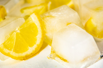 Fototapeta na wymiar Refreshing ice cubes with lemon