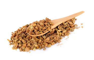 Dried chrysanthemum flowers in wooden spoon  isolated on white background